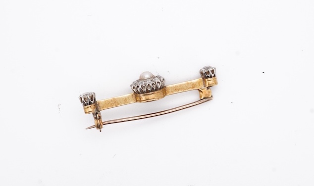 An early to mid 20th century yellow metal, split pearl and diamond cluster set bar brooch, 37mm, gross weight 4.3 grams. Condition - fair